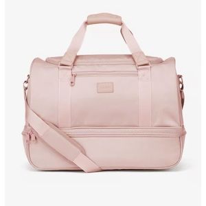 Calpak Stevyn duffel bag with shoe compartment in pink